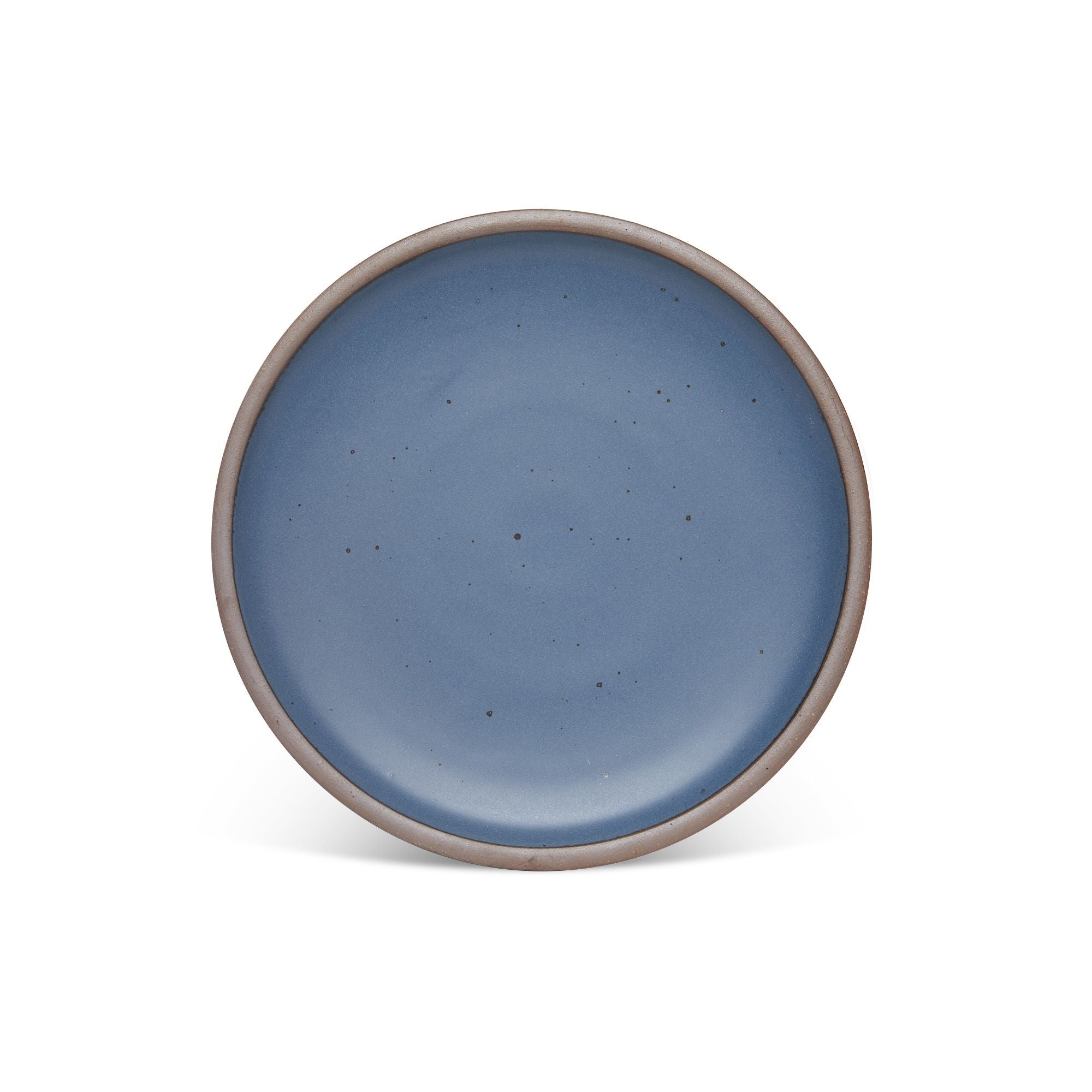 A dinner sized ceramic plate in a cool, medium blue color featuring iron speckles and an unglazed rim.