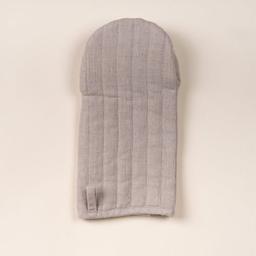 Natural color linen oven mitt with stitched channels and a small hanging loop, laid flat on a light background.