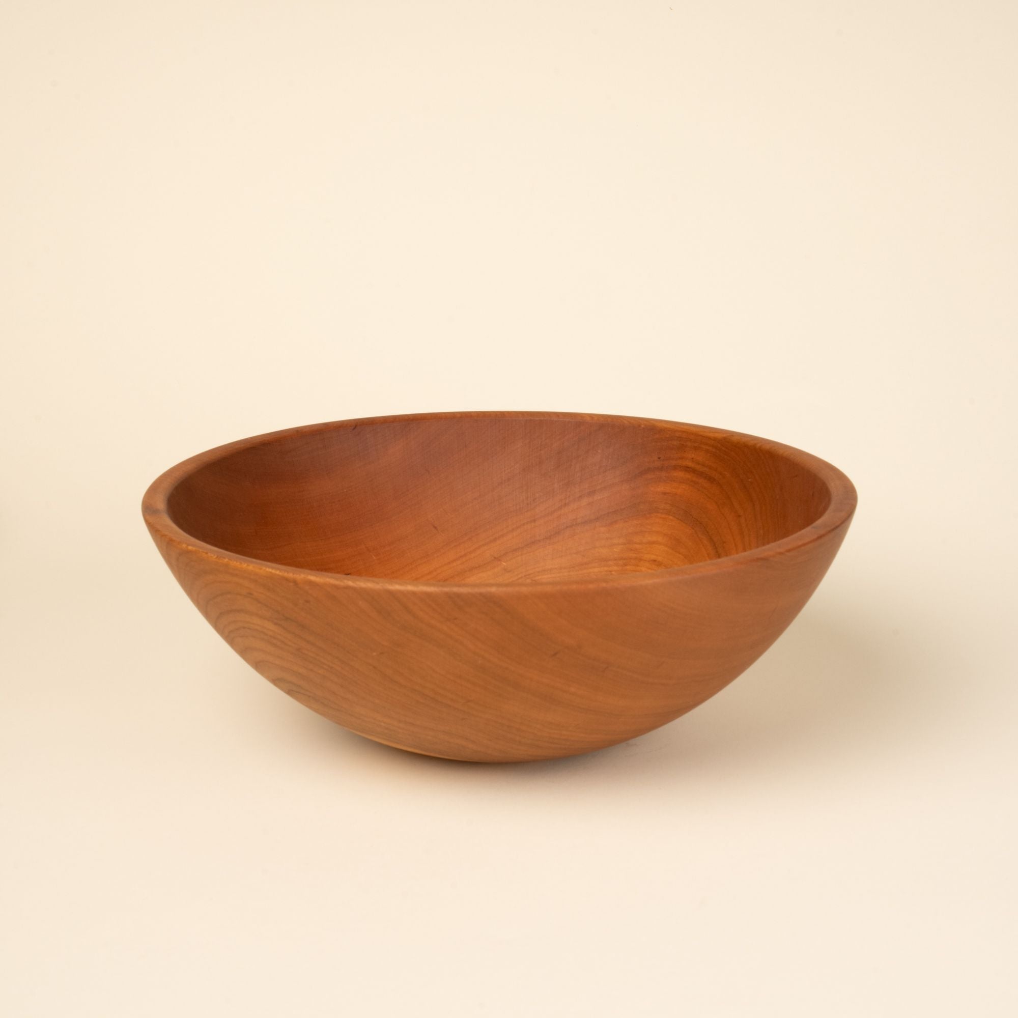 A large cherry wood bowl