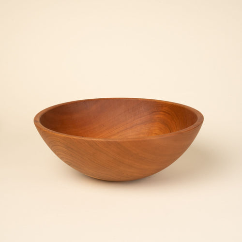 A large cherry wood bowl