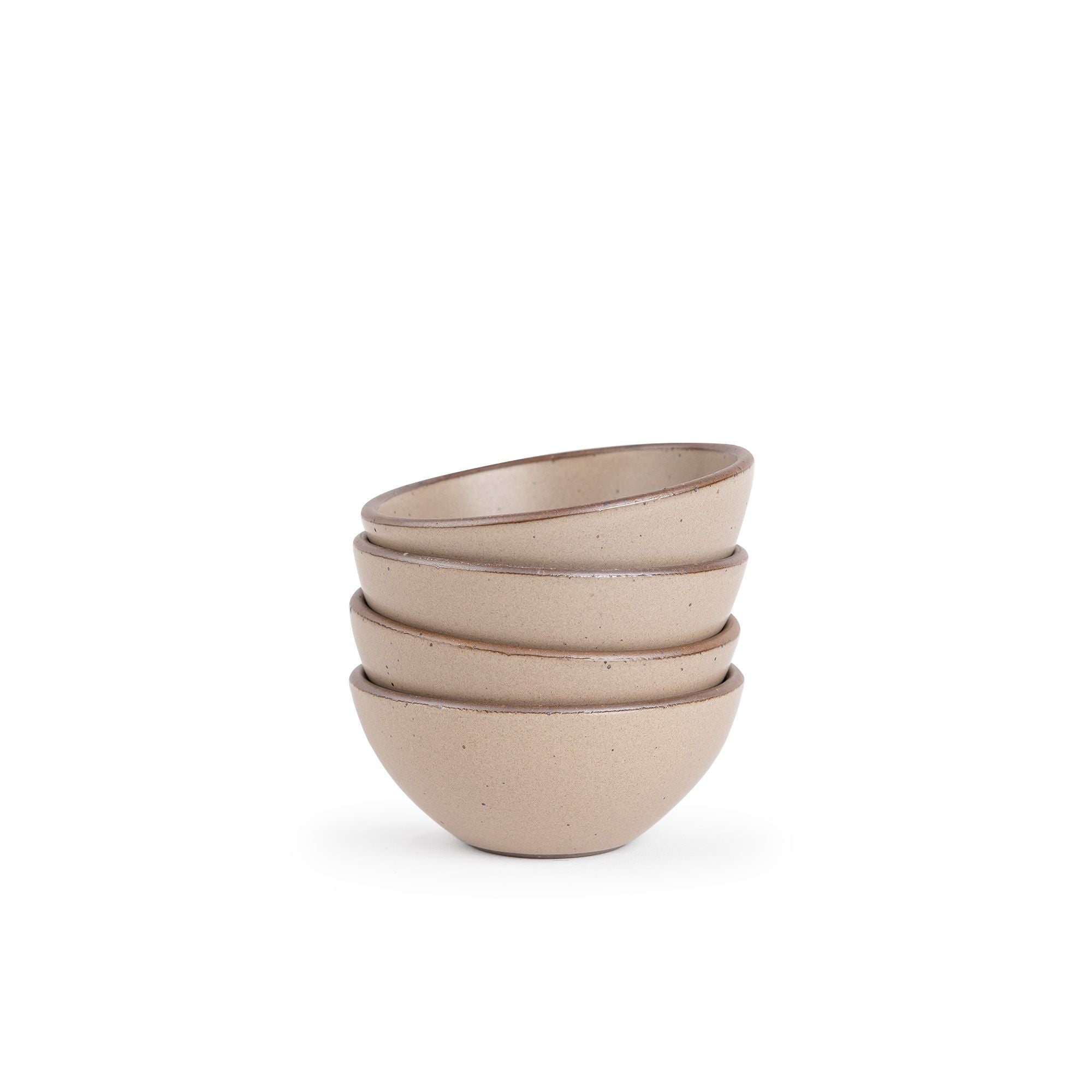 A stack of 4 small dessert sized rounded ceramic bowls in a warm pale brown color featuring iron speckles and an unglazed rim