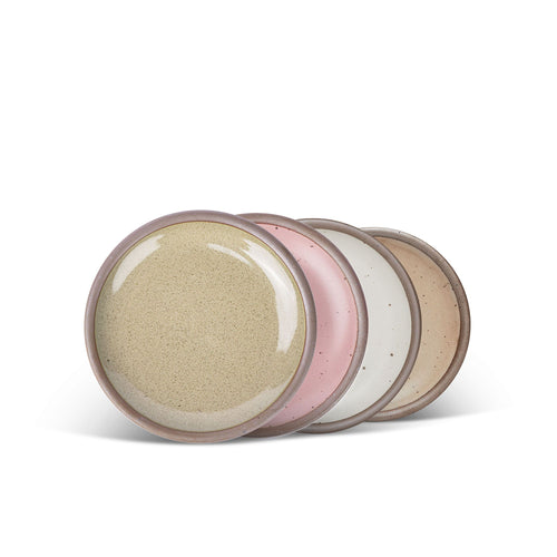 4 dessert sized ceramic plates in a reflective dappled grey-green, warm off-white, dusty mauve pink and pale warm brown color featuring iron speckles and an unglazed rim.