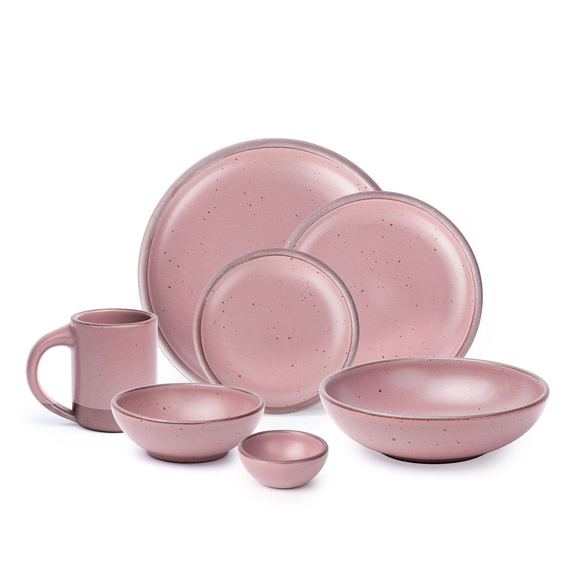 The Mug, bitty bowl, breakfast bowl, everyday bowl, cake plate, side plate and dinner plate in a dusty mauve pink color featuring iron speckles