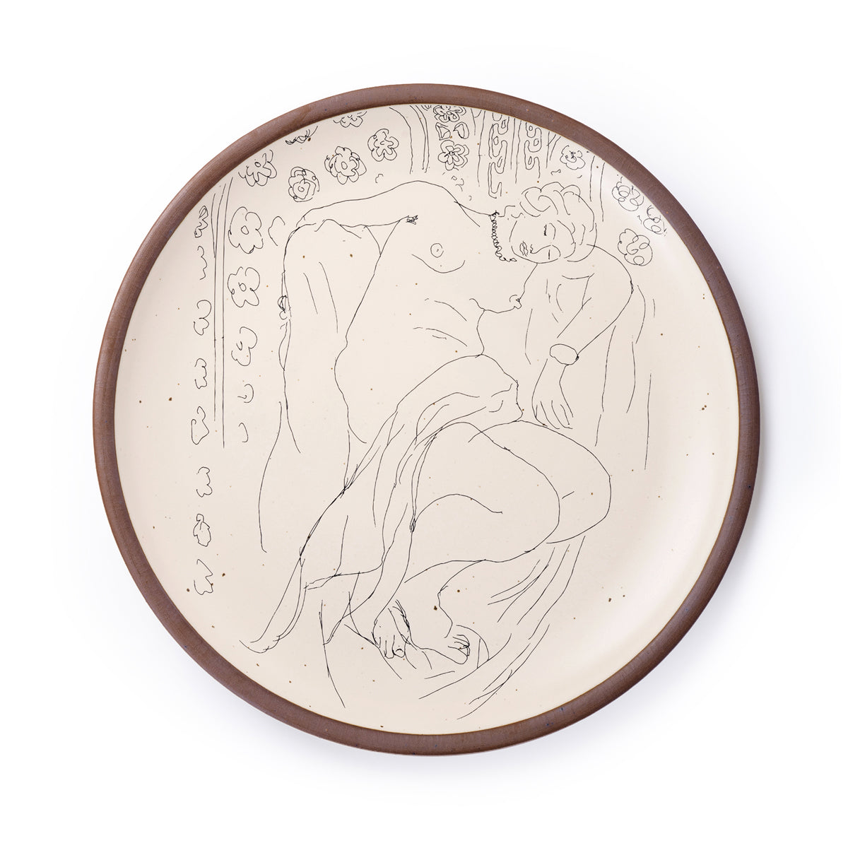 A large serving platter in a warm off-white color with unglazed rim with a black decal of the artwork, Figure endormie sur fond moucharabieh, from Henri Matisse.