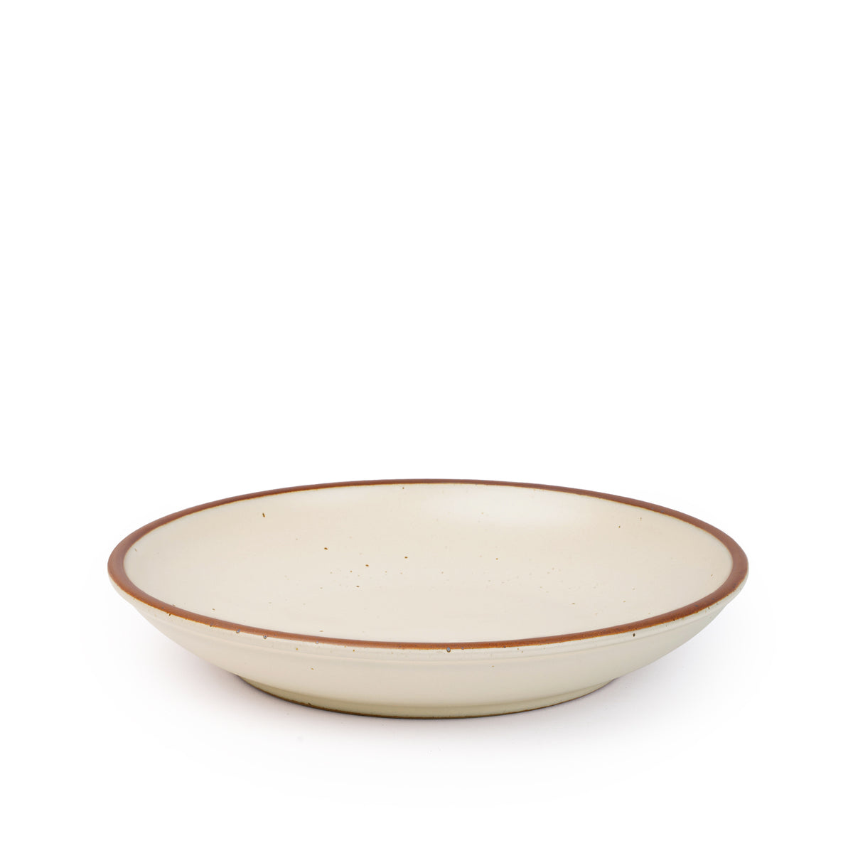 A large ceramic plate with a curved bowl edge in a warm, tan-toned, off-white color featuring iron speckles and an unglazed rim.