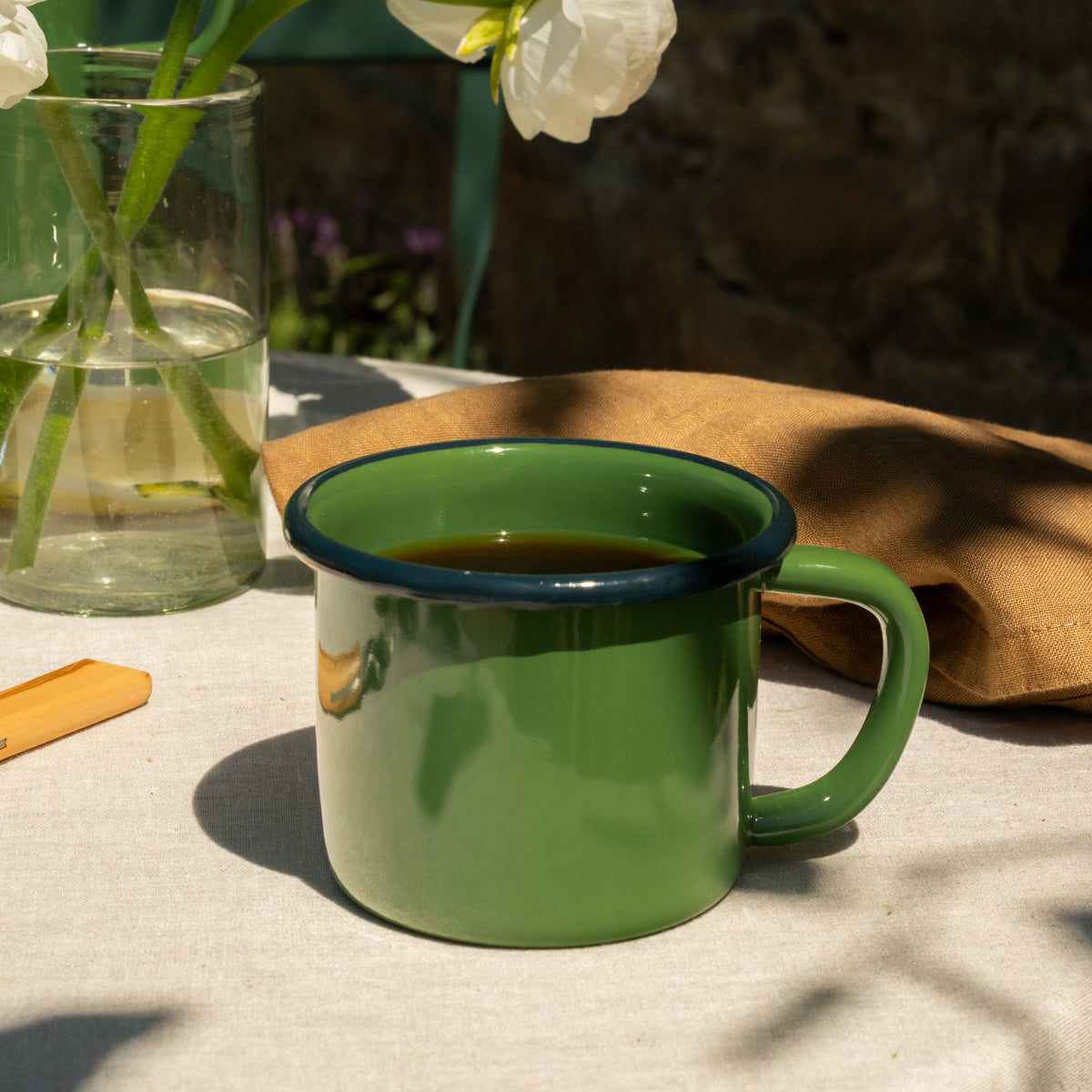 A coffee pot with a kettle resting on it, showcasing a cozy kitchen atmosphere.