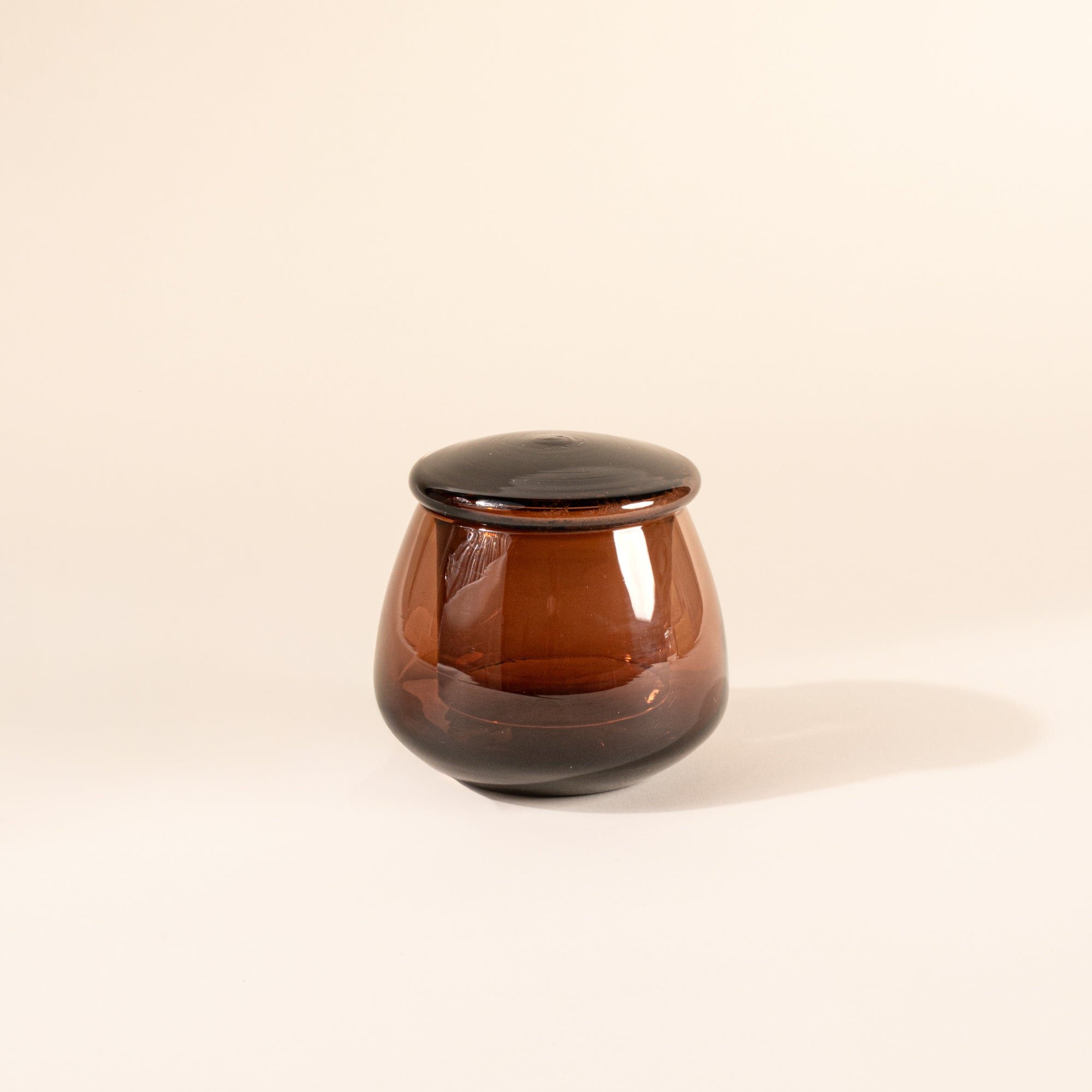 Walnut clear glass butter keeper on white background