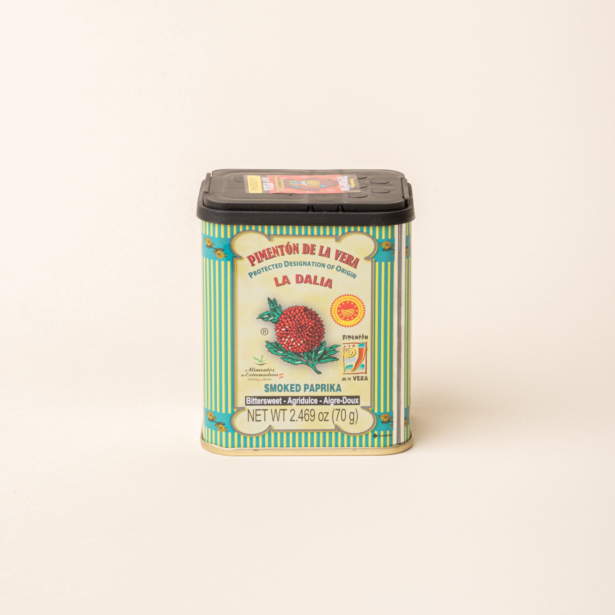 Tin of La Dalia smoked paprika with a black lid on a plain white background.