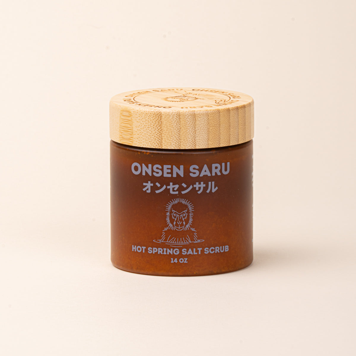 Onsen Saru Hot Spring Salt Scrub in an amber jar with a bamboo lid.