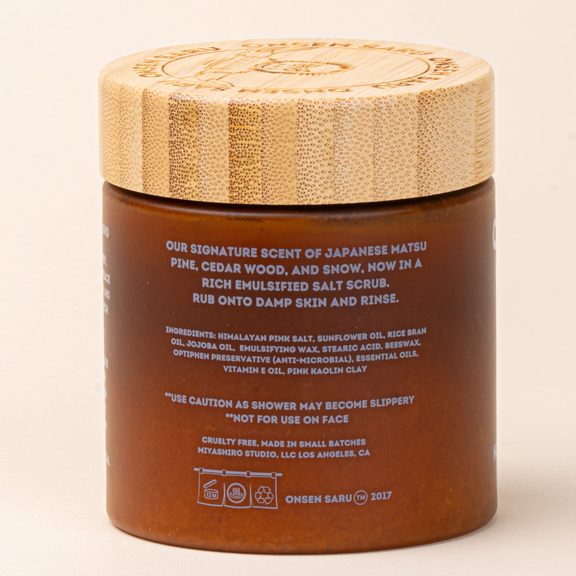 Back of Onsen Saru Hot Spring Salt Scrub in an amber jar with a bamboo lid