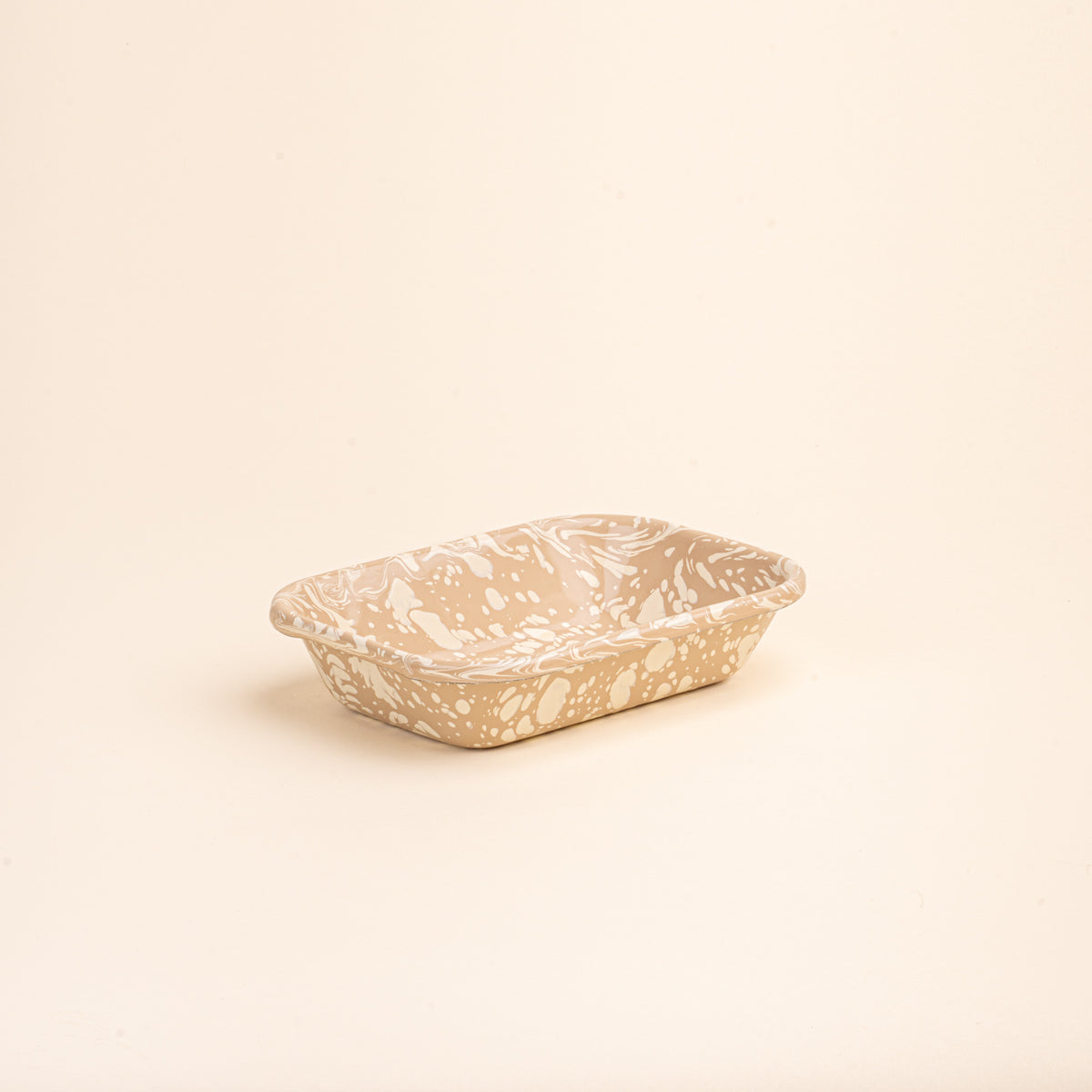 Small rectangular baking dish in a neutral tan color with off-white splattered pattern.