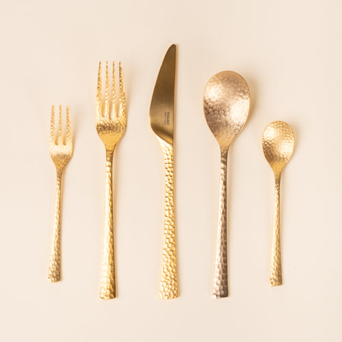 Hammered stainless steel 5 piece flatware in a gold color