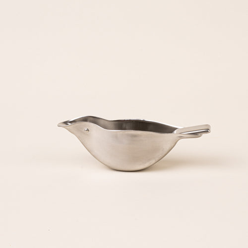 A sculptural stainless-steel lemon squeezer with a bird-like silhouette.