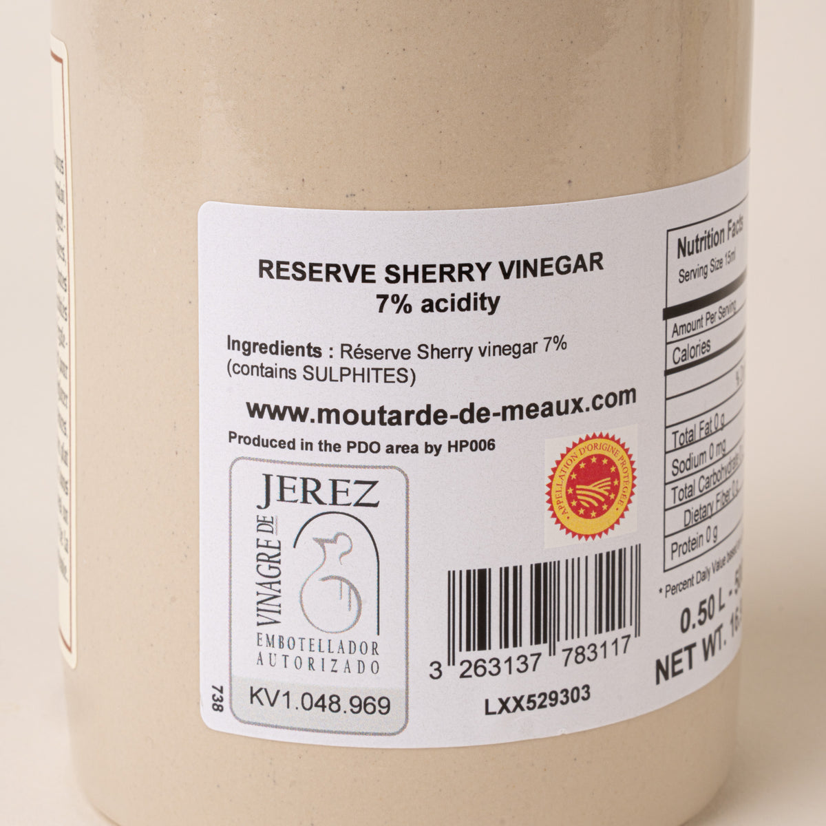 Close-up of the back label of Pommery reserve sherry vinegar showing ingredients, nutrition facts, certification seals, and barcode.