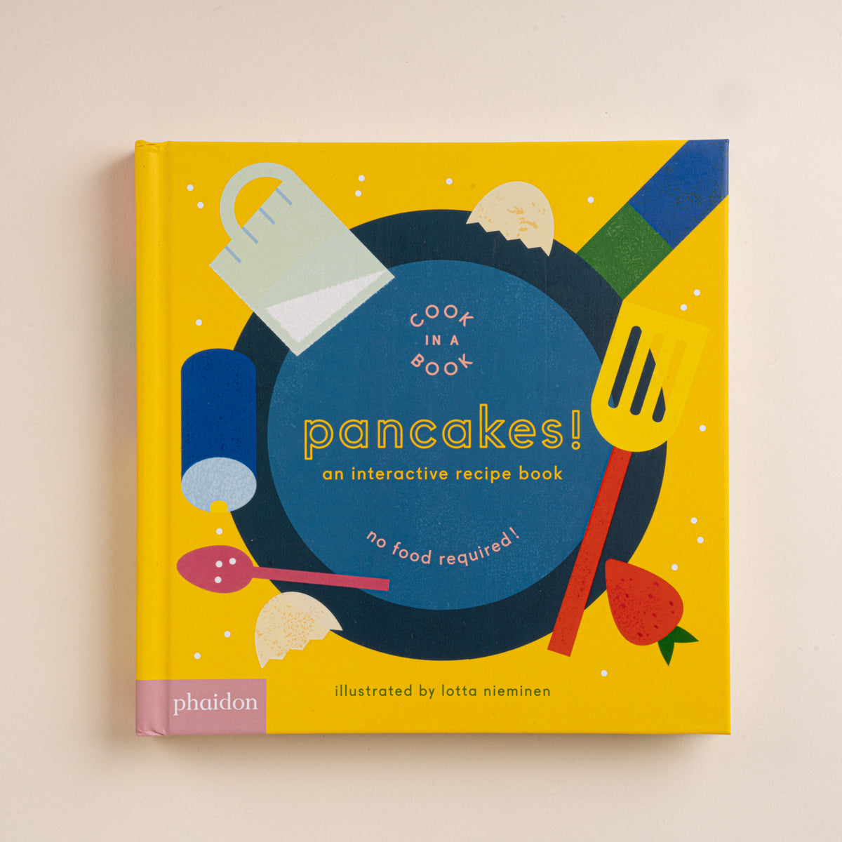 Yellow cover of the children’s book Pancakes! An Interactive Recipe Book with illustrated cooking utensils.