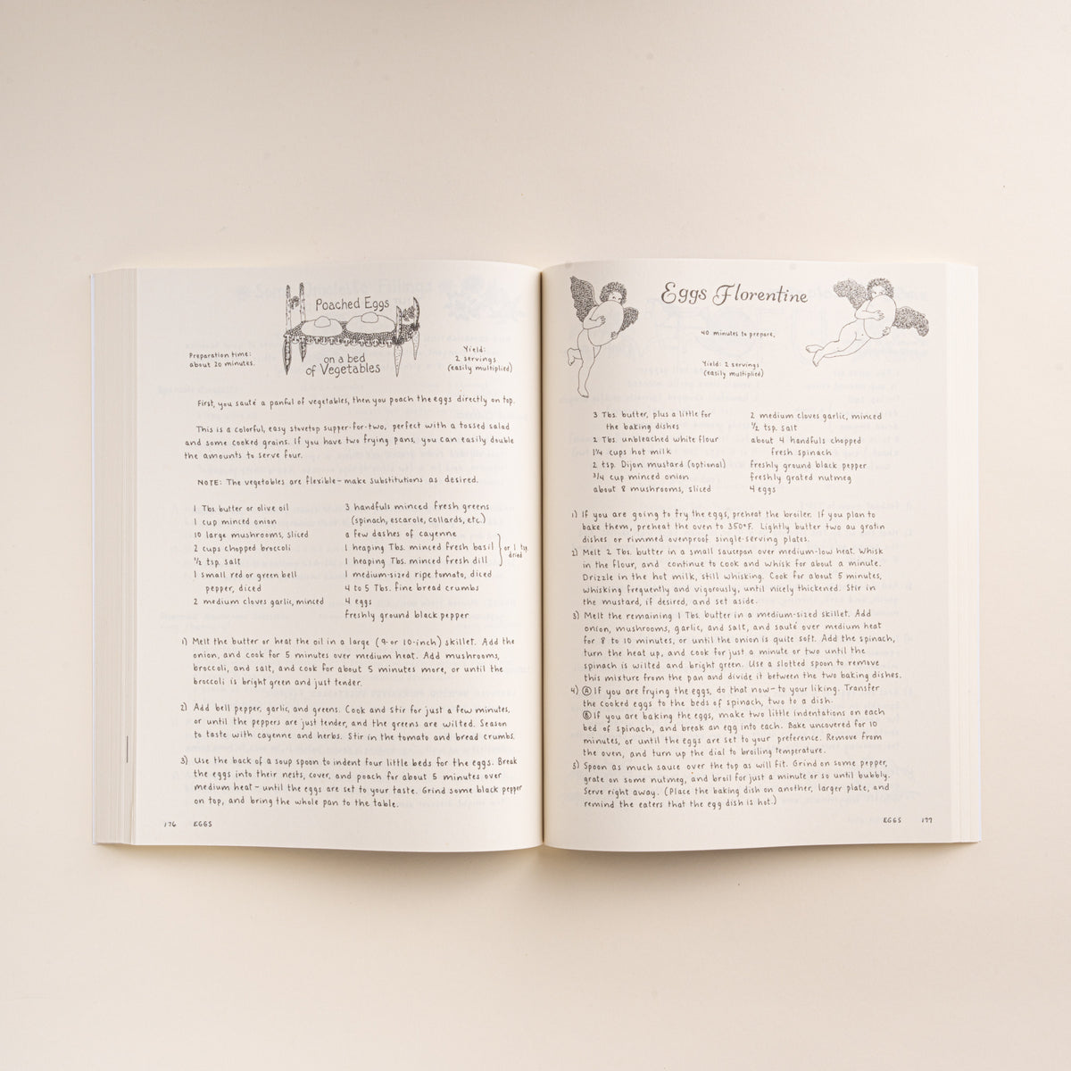 Open cookbook showing recipes for Poached Eggs on a Bed of Vegetables and Eggs Florentine.