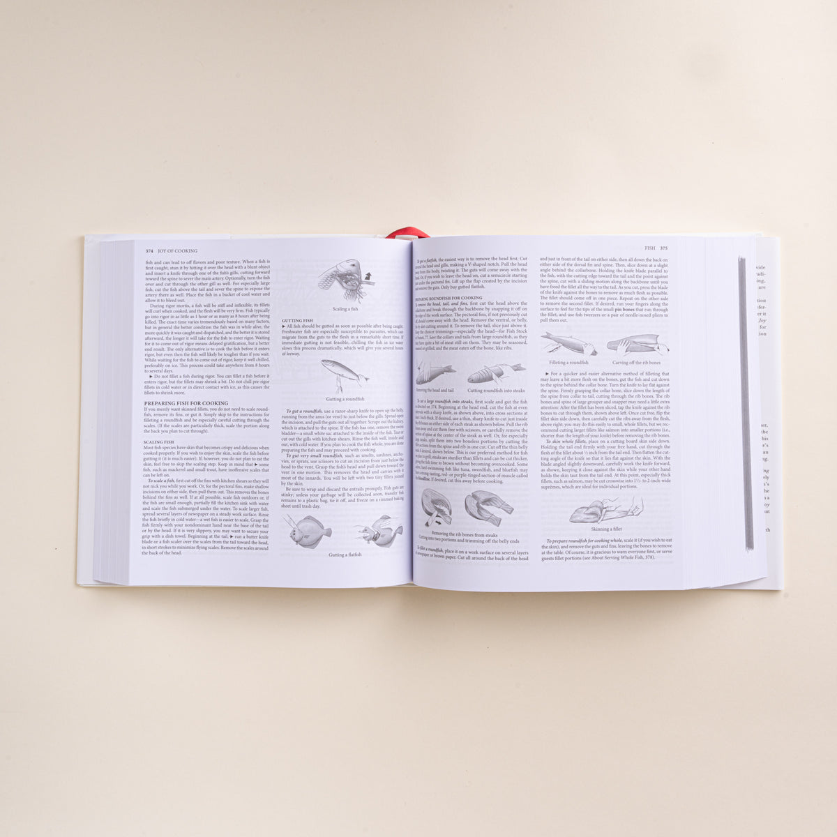 Open Joy of Cooking cookbook showing illustrated instructions for preparing, scaling, cutting, and filleting fish.
