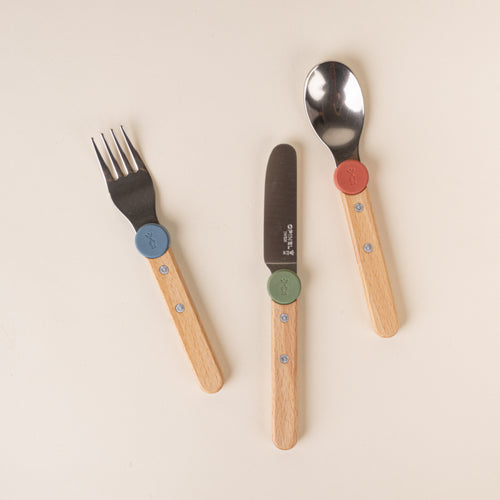Children's fork, knife, and spoon with wooden handles and blue, green, and red accents.
