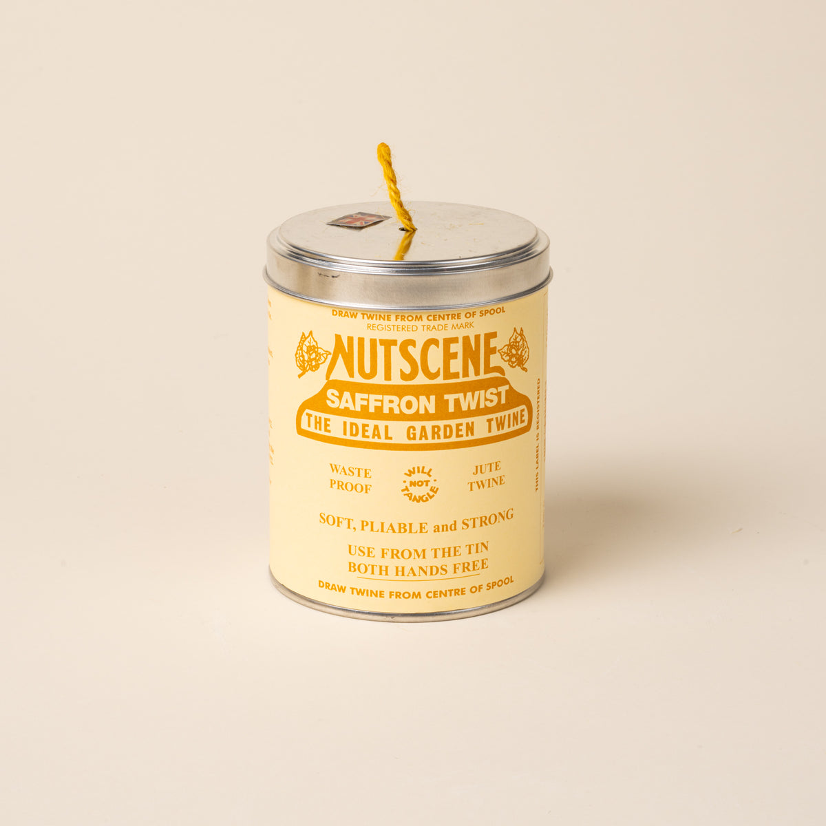 Metal tin of Nutscene Saffron Twist garden twine with yellow jute string.