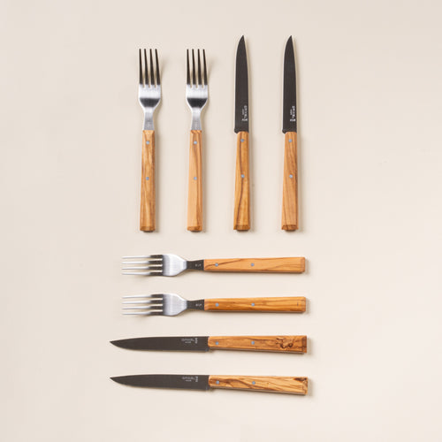 Set of 8 Opinel table knives and forks with wooden handles.