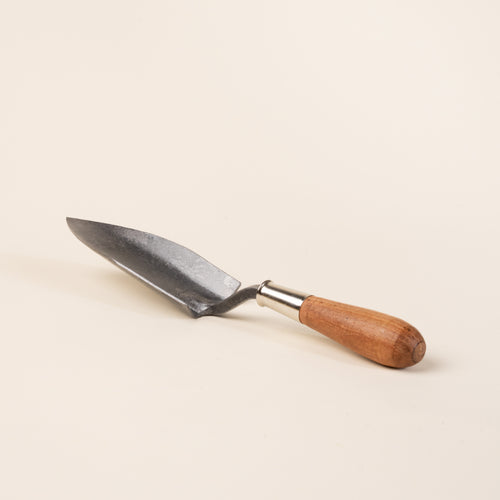 Handheld garden trowel with a pointed blade and wooden handle.
