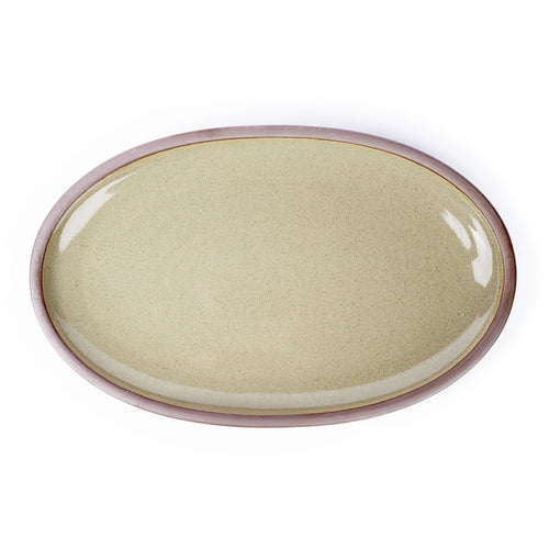 A large oval ceramic platter in a reflective dappled grey-green color with an unglazed rim