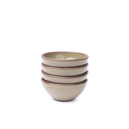 A stack of 4 small dessert sized rounded ceramic bowls in a reflective dappled grey-green color featuring unglazed rims