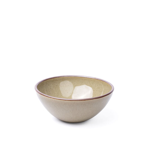 A medium rounded ceramic bowl in a reflective dappled grey-green color featuring an unglazed rim