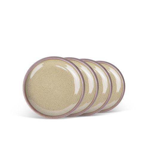 A stack of 4 dessert sized ceramic plates in a reflective dappled grey-green color featuring an unglazed rim.