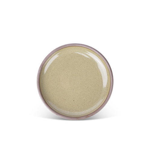 A medium sized ceramic plate in a reflective dappled grey-green color featuring an unglazed rim