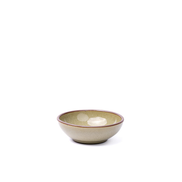 A small shallow ceramic bowl in a reflective dappled grey-green color featuring an unglazed rim
