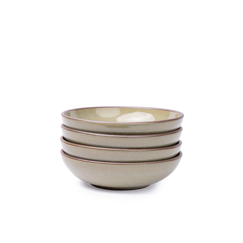 A stack of 4 dinner-sized shallow ceramic bowls in a reflective dappled grey-green color featuring an unglazed rim
