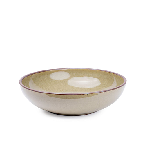 A large shallow serving ceramic bowl in a reflective dappled grey-green color featuring an unglazed rim