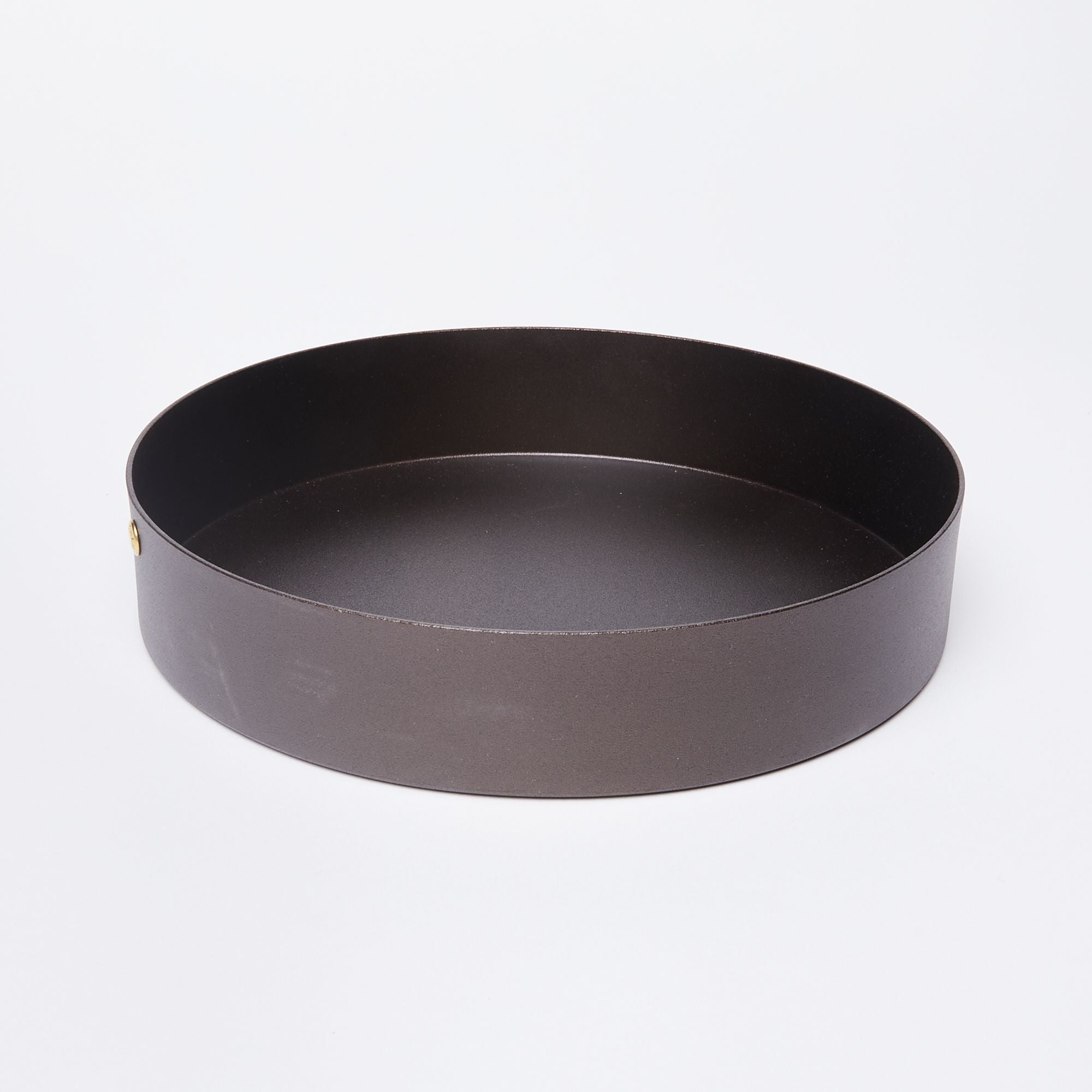 A round black metal cake pan