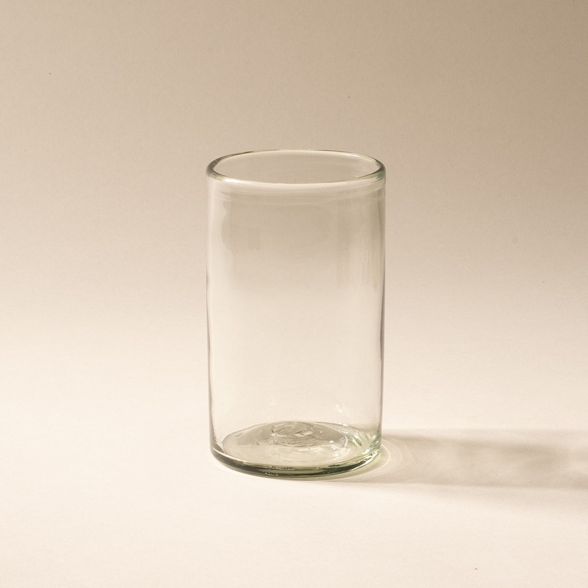 A tall clear drinking glass