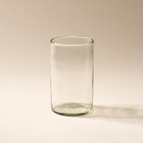 A tall clear drinking glass