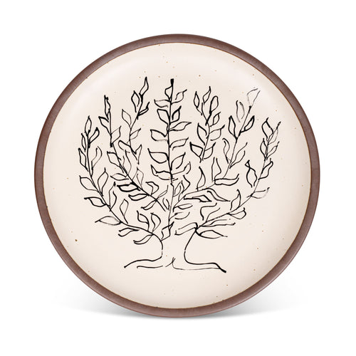 A large serving platter in a warm off-white color with unglazed rim with a black decal of the artwork, Le Platane, from Henri Matisse.