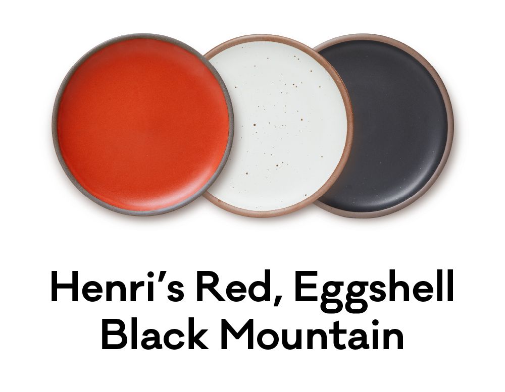 A bold palette of red, white and black plates are positioned next to each other. Underneath, text reads