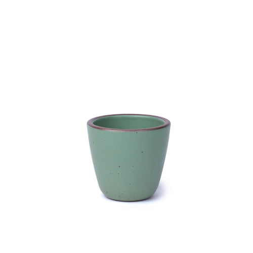 A handleless ceramic cup with a gently tapered form in a viridian green glaze with a matte finish.