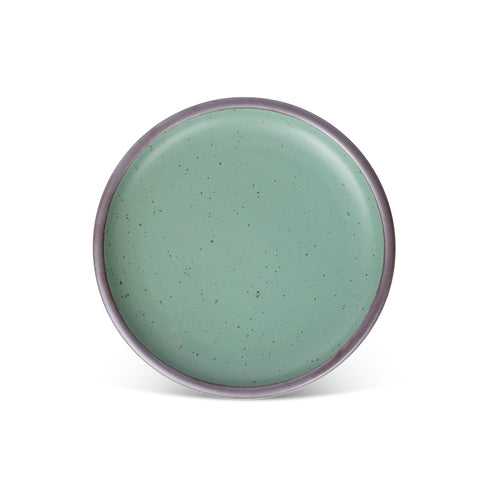 A ceramic plate with a wide surface and low rims in a viridian green glaze with a matte finish.