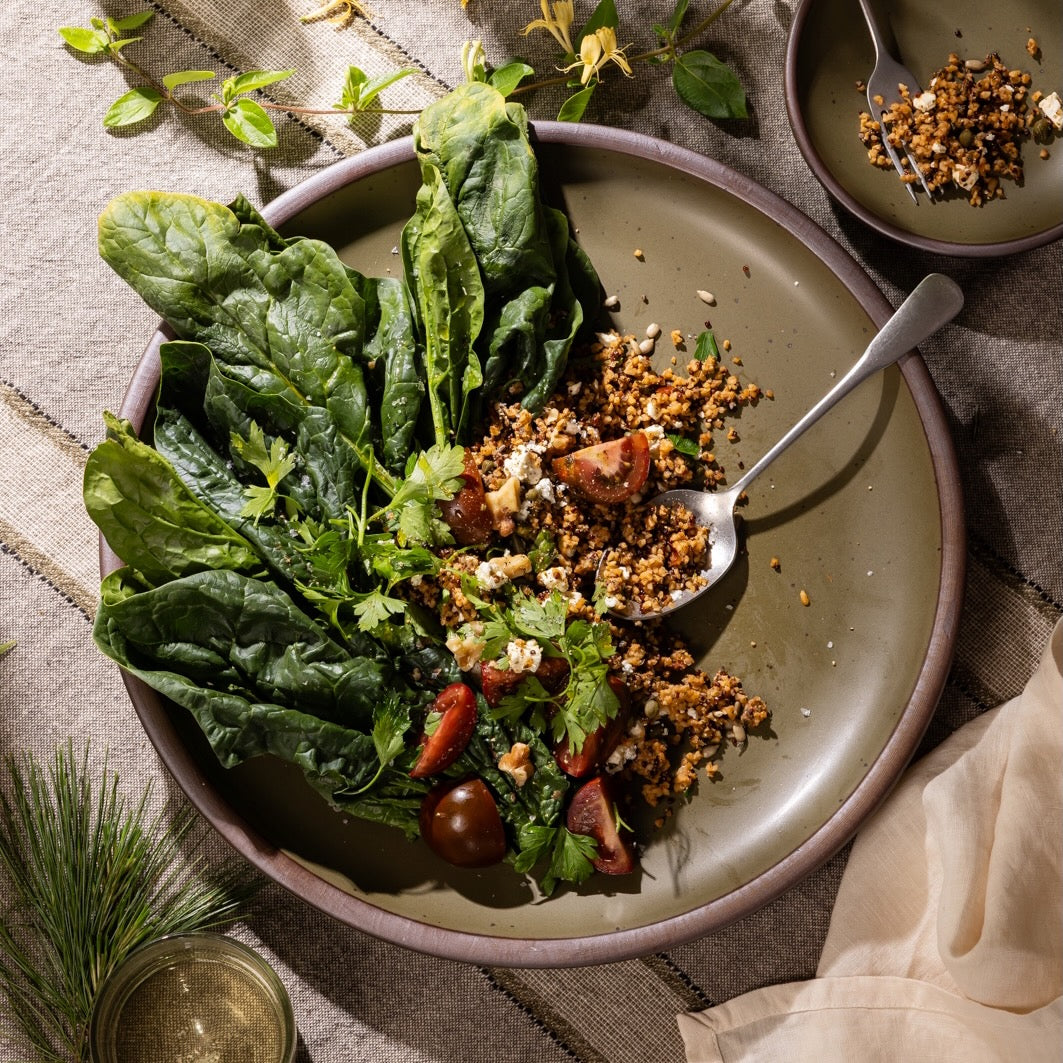 Olive-toned stoneware serving platter, styled with fresh greens, grains, and seasonal vegetables for everyday dining.