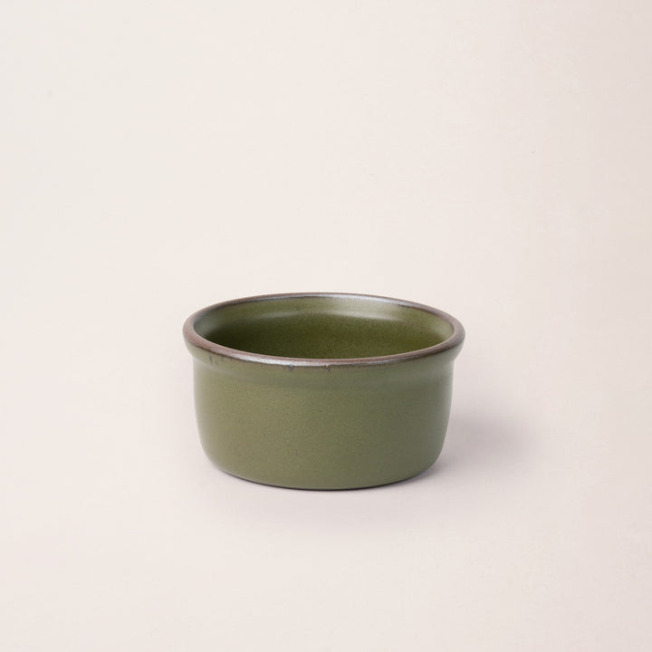 Medium ceramic ramekin in an olive green color with an unglazed rim