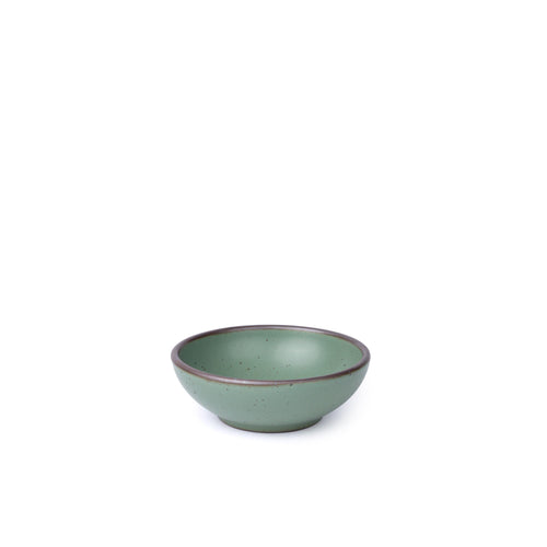 A shallow ceramic bowl for cereal or yogurt in a viridian green glaze with a matte finish.