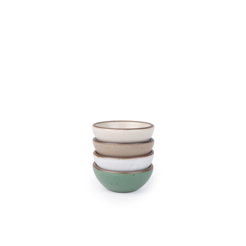 Four small ceramic bowls for salt, mise en place, or jewelry in a viridian green, warm brown, warm white and cool white glazes.
