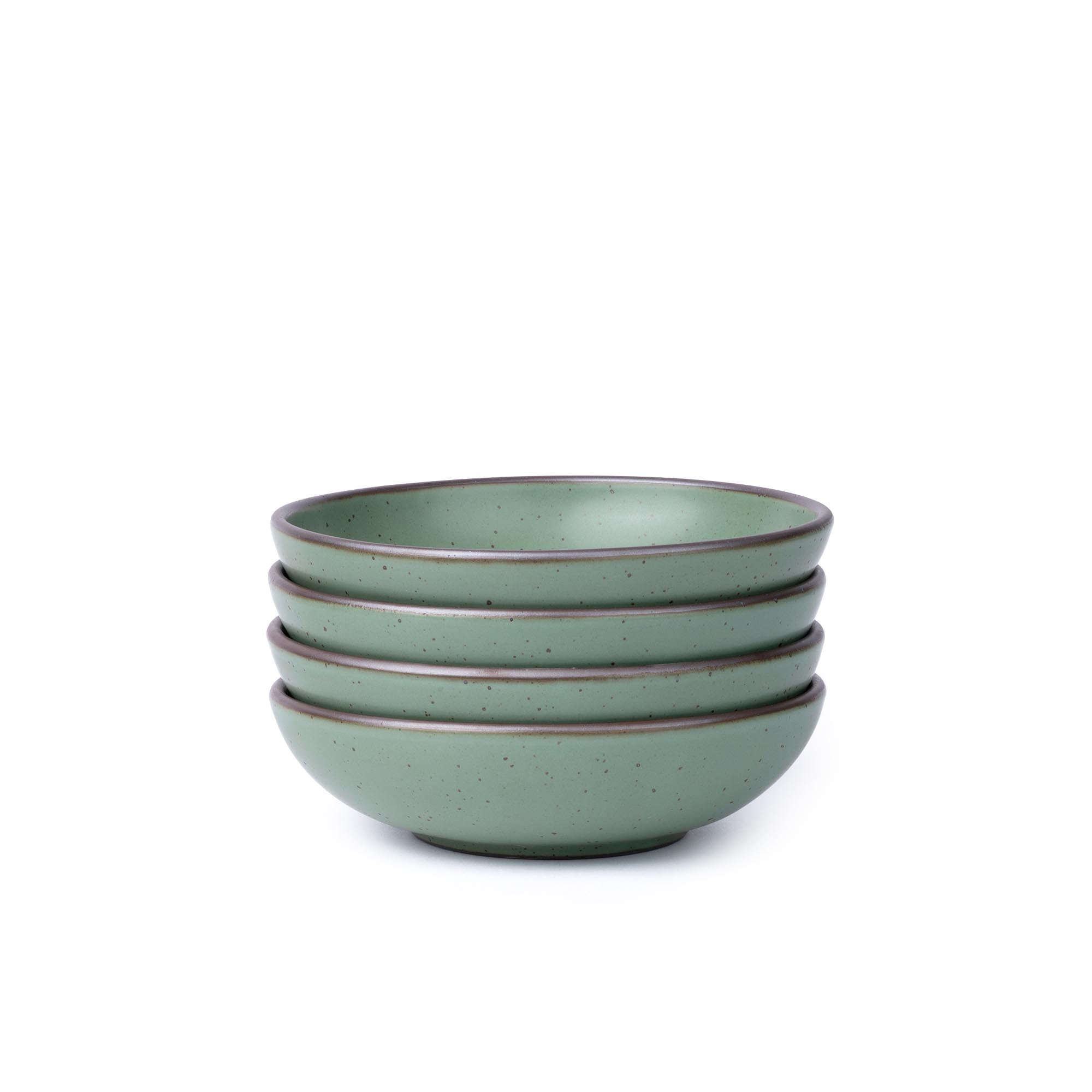 Four shallow ceramic bowls for daily meals in a viridian green glaze with a matte finish.
