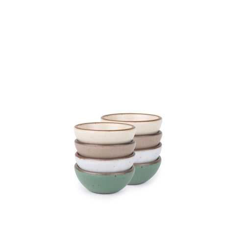 Eight small ceramic bowls for salt, mise en place, or jewelry in a viridian green, warm brown, warm white and cool white glazes.