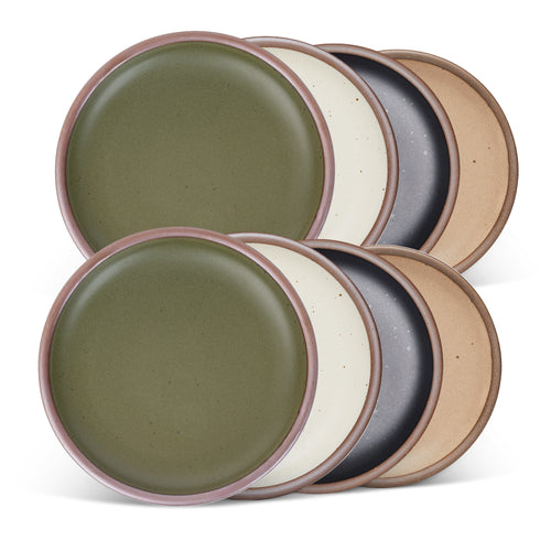 8 medium sized ceramic plates in an olive green, graphite black, warm pale brown, and off-white colors featuring iron speckles and an unglazed rim.