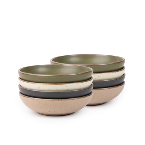 8 dinner-sized shallow ceramic bowls in an olive green, graphite black, off-white, and pale warm brown colors featuring iron speckles and an unglazed rim