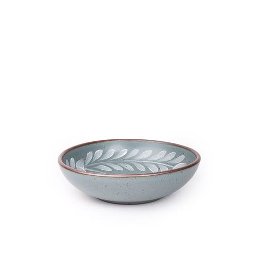 Medium ceramic shallow bowl with a hand-painted white leaf border on a blue-grey interior and exterior with an exposed clay rim.