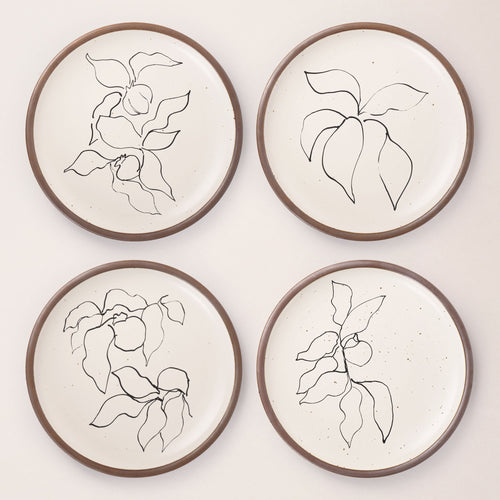 Four round ceramic dinner plates featuring Verve illustrations by Henri Matisse.